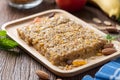 Homemade Cereal granola bars with nuts and garnola, milk bottle, apple, banana on wooden desk, Energy food, Healthy snack Royalty Free Stock Photo