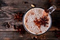 Homemade Chai Tea Latte with anise and cinnamon stick in glass mug. Top view