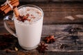 Homemade Chai Tea Latte with anise and cinnamon stick in glass mug