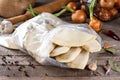 Homemade chebureks - Russian dumplings. Meat dumplings, ravioli. Dumplings with stuffing on a table with ingredients