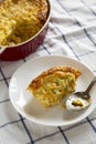 Homemade Cheddar Corn Pudding Casserole on a white plate, low angle view. Close-up Royalty Free Stock Photo
