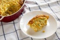 Homemade Cheddar Corn Pudding Casserole on a white plate, side view. Close-up Royalty Free Stock Photo