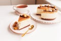 Homemade cheese cake for dessert. Slice of delicious cheesecake with carame on a white table Royalty Free Stock Photo