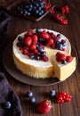 Homemade cheese cake with strawberry and winter berries. New York Cheesecake. Christmas dessert. Healthy food.