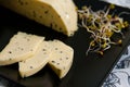 Homemade cheese with Nigella sativa seeds and radish sprouts