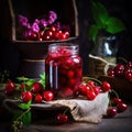 Homemade cherry jam in a glass jar and fresh berries on a dark wooden background. Royalty Free Stock Photo