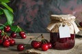 Homemade Cherry Jam in Glass Jar with Fresh Cherries on Wooden Table Royalty Free Stock Photo