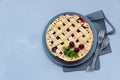 Homemade cherry lattice cake on gray wooden background. Traditional american food. Top view