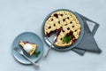 Homemade cherry lattice cake on gray wooden background. Traditional american food. Top view