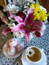 Homemade cherry marshmallows with a cup of green tea on a table . Royalty Free Stock Photo