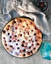 Homemade Cherry pie on round serving board. Royalty Free Stock Photo