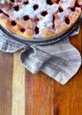 Homemade Cherry pie on round serving board. Royalty Free Stock Photo