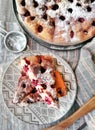 Homemade Cherry pie on round serving board. Royalty Free Stock Photo