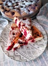 Homemade Cherry pie on round serving board. Royalty Free Stock Photo