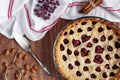 Homemade cherry pie on rustic background