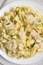 Homemade Chicken Fettuccine Alfredo in a plate on a white wooden table, top view. Flat lay, overhead, from above. Close-up Royalty Free Stock Photo