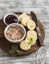 Homemade chicken liver pate, cranberry sauce and homemade cheese biscuits. Delicious snack or appetizer with wine. Royalty Free Stock Photo