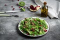 Homemade chicken liver Salad. Warm salad with arugula, chicken liver, kiwi and pomegranate. Healthy lunch menu. Diet food. Top