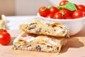 Fresh piece of savory strudel stuffed with chicken meat and mushrooms s