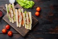 Homemade chicken sandwich, on old wooden table, top view with copy space for text Royalty Free Stock Photo