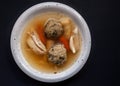 Homemade chicken soup with vegetables and liver dumplings. Royalty Free Stock Photo