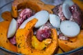 Homemade Chicken thighs and pumpkin pieces baking in glass form. Royalty Free Stock Photo