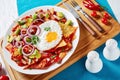 Chilaquiles with a fried egg on a plate Royalty Free Stock Photo