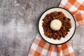 Homemade Chili Beans with Rice on a white round plate on a dark grey background Royalty Free Stock Photo