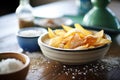 homemade chips in a ceramic dish with sea salt