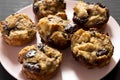 Homemade Chocolate Banana Bread Pudding on a pink plate on a black background, low angle view. Closeup Royalty Free Stock Photo