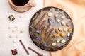 Homemade chocolate brownie cake with caramel cream and almonds with cup of coffee on a white concrete  background. top view, close Royalty Free Stock Photo