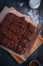 Homemade chocolate brownies on cutting board, top view Royalty Free Stock Photo