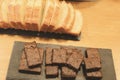Homemade chocolate brownies and sliced buttercake on wooden table, top view, toned image Royalty Free Stock Photo