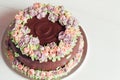 Homemade chocolate cake with colorful cream flowers