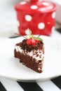 Homemade chocolate cake with cream and cherry