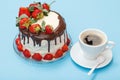 Homemade chocolate cake decorated with fresh strawberries on glass plate and cup of coffee with saucer Royalty Free Stock Photo