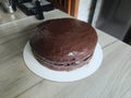 Homemade chocolate cake on the kitchen table Royalty Free Stock Photo