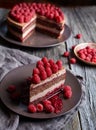 Homemade chocolate cake mousse cheesecake with fresh raspberries on the rustic wooden table. Royalty Free Stock Photo