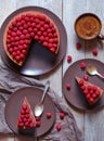 Homemade chocolate cheesecake cake with raspberries and coffee on the rustic table. Concept of a romantic breakfast. Royalty Free Stock Photo