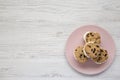 Homemade Chocolate Chip Cookie Ice Cream Sandwich on a pink plate on a white wooden background, top view. Overhead, from above, Royalty Free Stock Photo