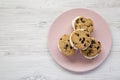 Homemade Chocolate Chip Cookie Ice Cream Sandwich on a pink plate on a white wooden background, top view. Overhead, from above, Royalty Free Stock Photo