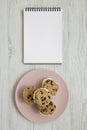 Homemade Chocolate Chip Cookie Ice Cream Sandwich on a pink plate on a white wooden table, top view. Overhead, from above, flat Royalty Free Stock Photo