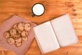 Homemade chocolate chip cookies, milk cup and open book Royalty Free Stock Photo