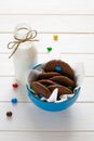 Homemade chocolate cookies decorated with colored candy drops and bottle of milk Royalty Free Stock Photo