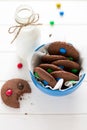 Homemade chocolate cookies decorated with colored candy drops and bottle of milk Royalty Free Stock Photo