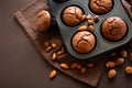 Homemade chocolate muffins brownies with cinnamon, almonds and hazelnuts on brown paper background Royalty Free Stock Photo