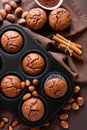 Homemade chocolate muffins brownies with cinnamon, almonds and hazelnuts Royalty Free Stock Photo