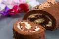 Homemade chocolate roll with fresh flowers