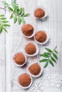 Homemade Chocolate truffles candy dessert on wooden background close up. Delicious chocolate praline with decor.