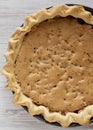 Homemade Chocolate Walnut Derby Pie on a white wooden table, top view. From above, overhead, flat lay. Close-up Royalty Free Stock Photo